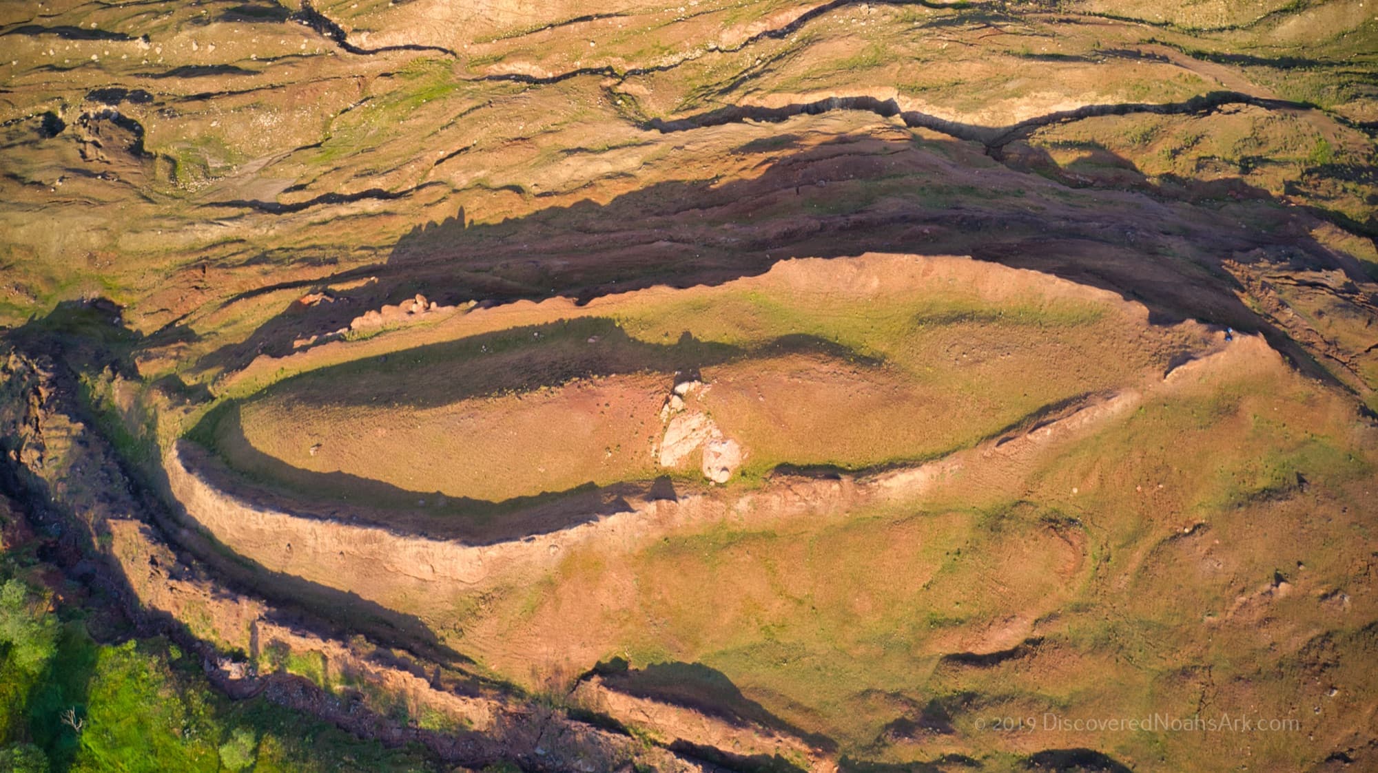 Aerial drone view of the Durupınar Noah's Ark boat formation in golden light